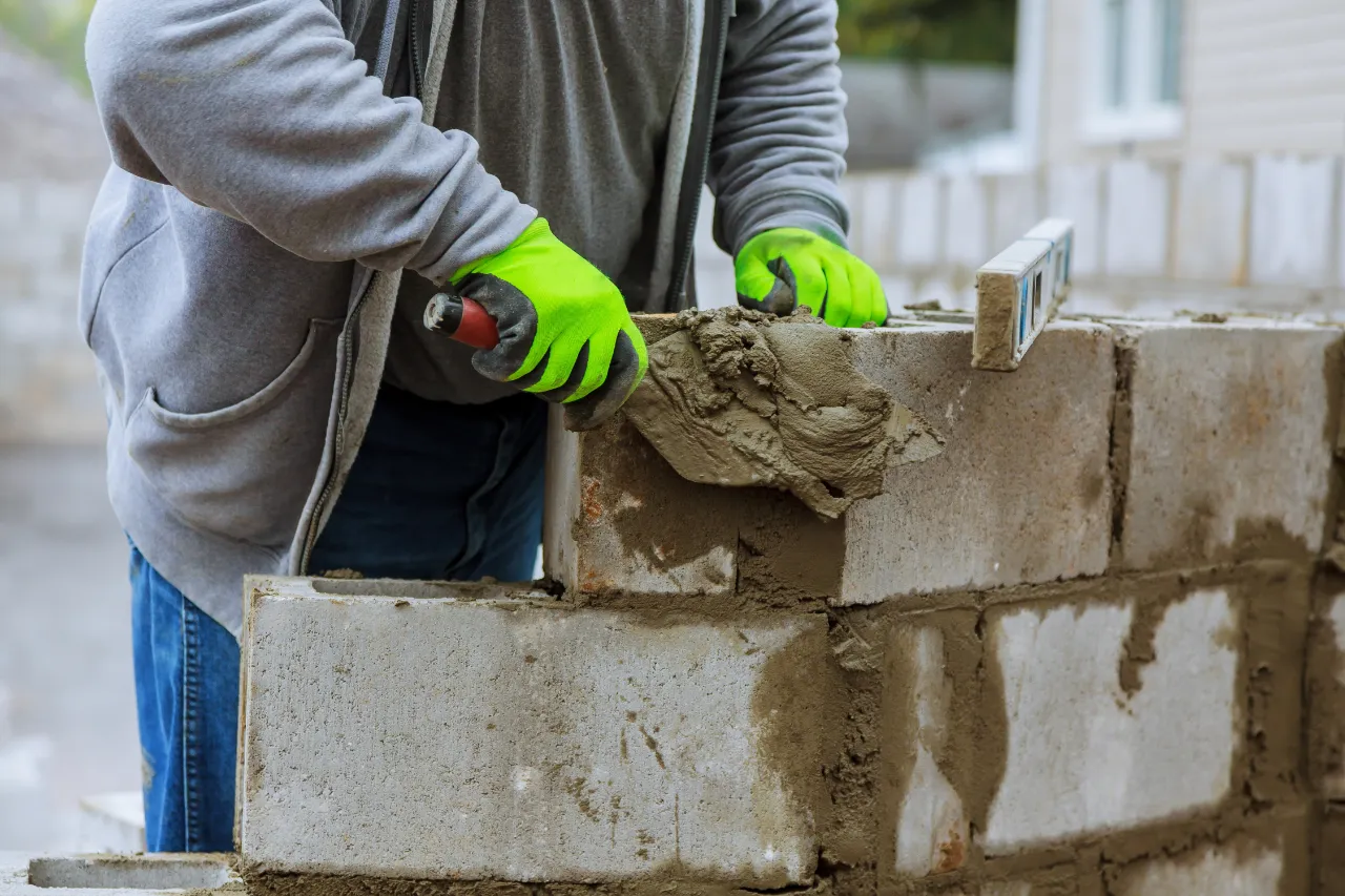 Laying blocks on wall