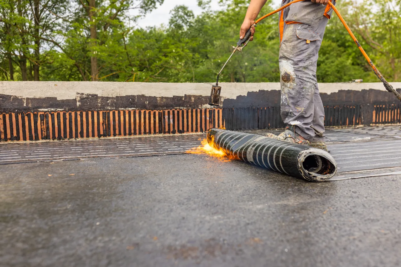 Torching roofing material