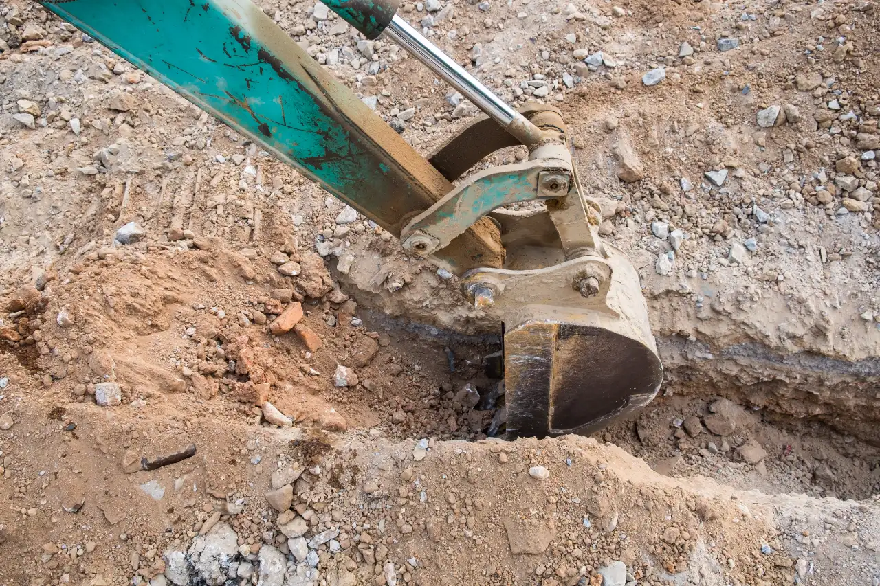 Backhoe dredging soil