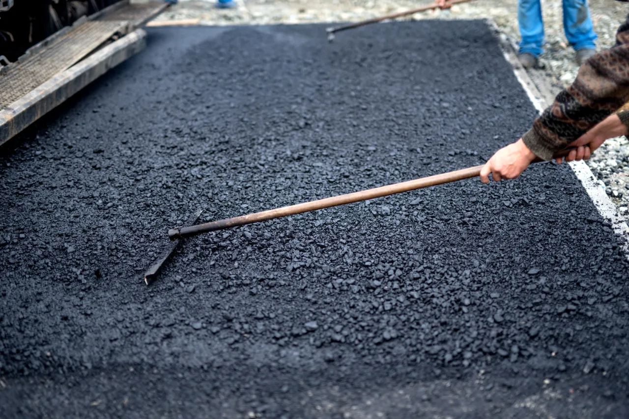 Leveling fresh asphalt